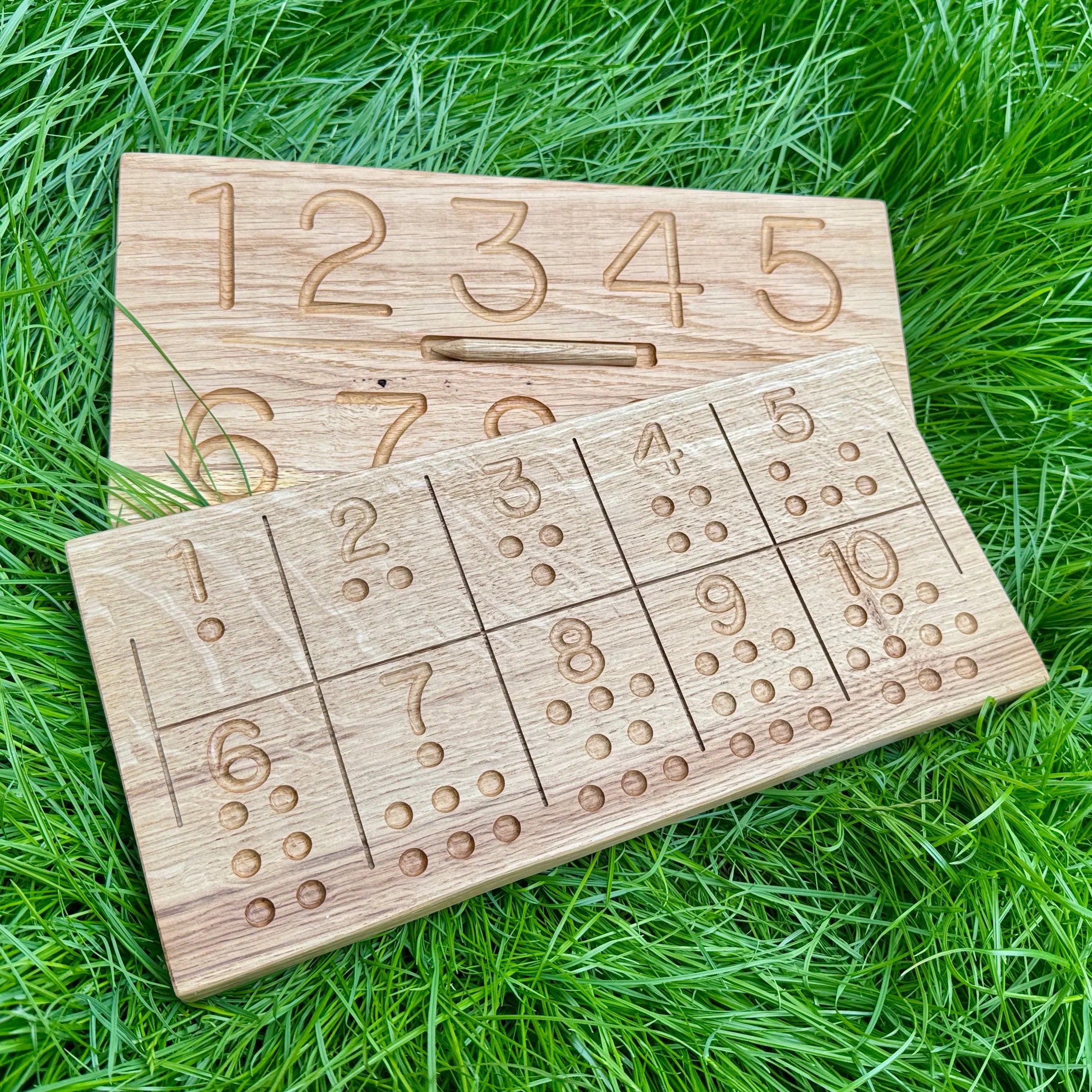 Numbers Tracing and Counting boards, laying on grass