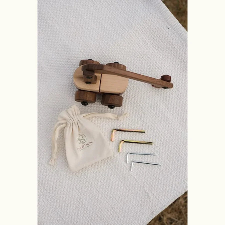 Walnut & Maple Crane viewed from above with included Allen keys and branded cotton pouch on linen
