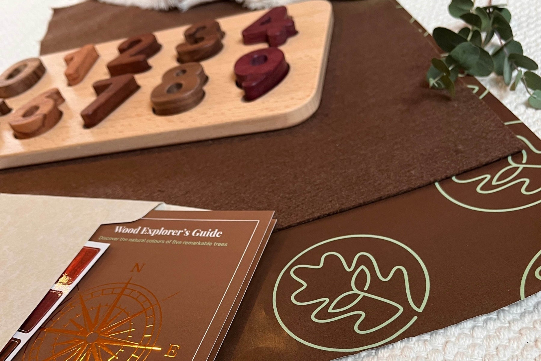 Early Literacy & Numeracy Bundle number puzzle board partially assembled, loose Tigerwood, Walnut and Mahogany pieces scatter