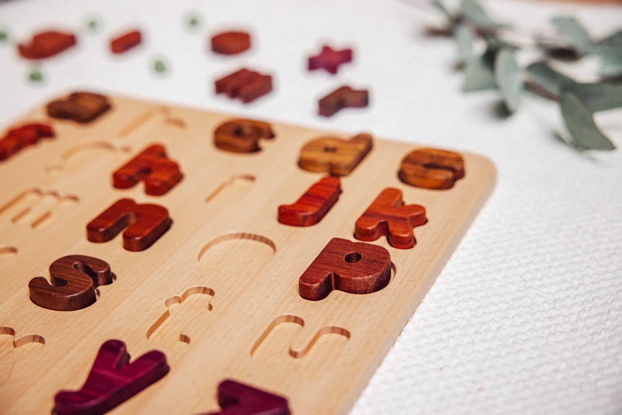 Heirloom wooden alphabet puzzle with natural hardwood colours