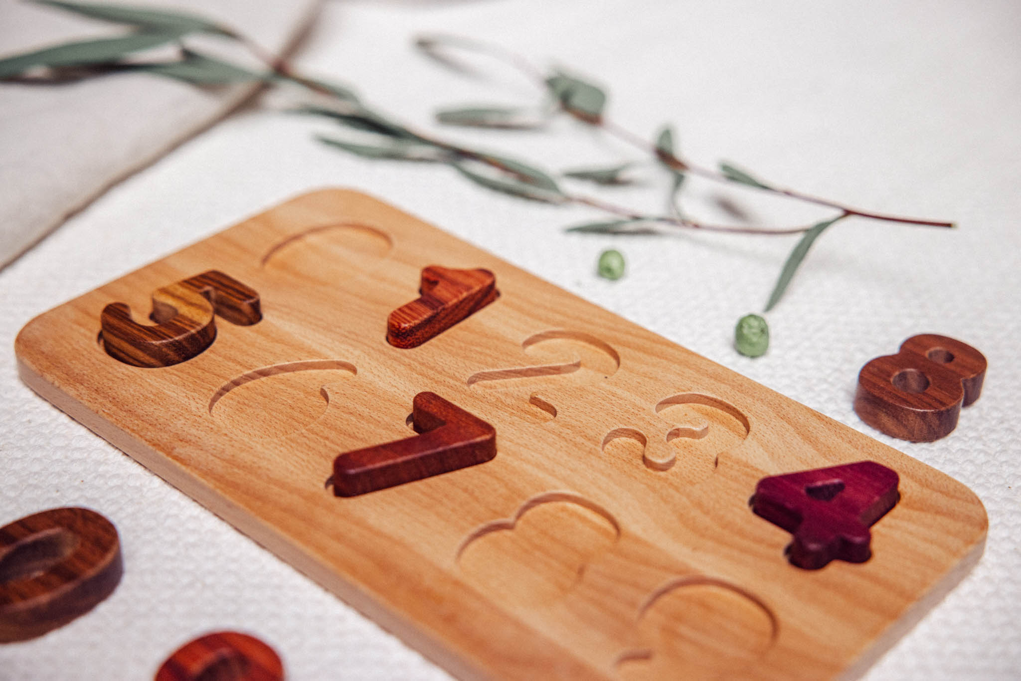 Wooden puzzle with letters on a light background