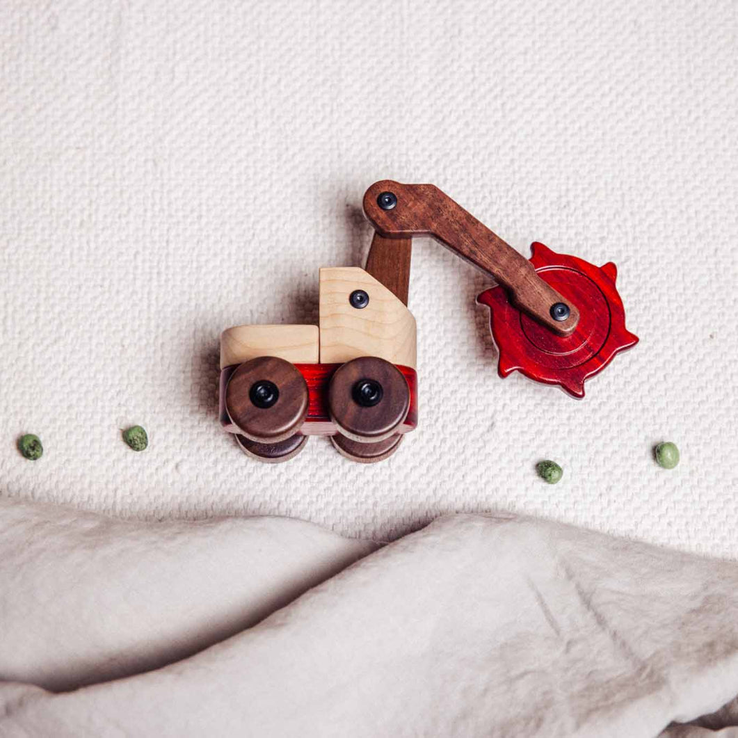 Toy bulldozer on a textured surface
