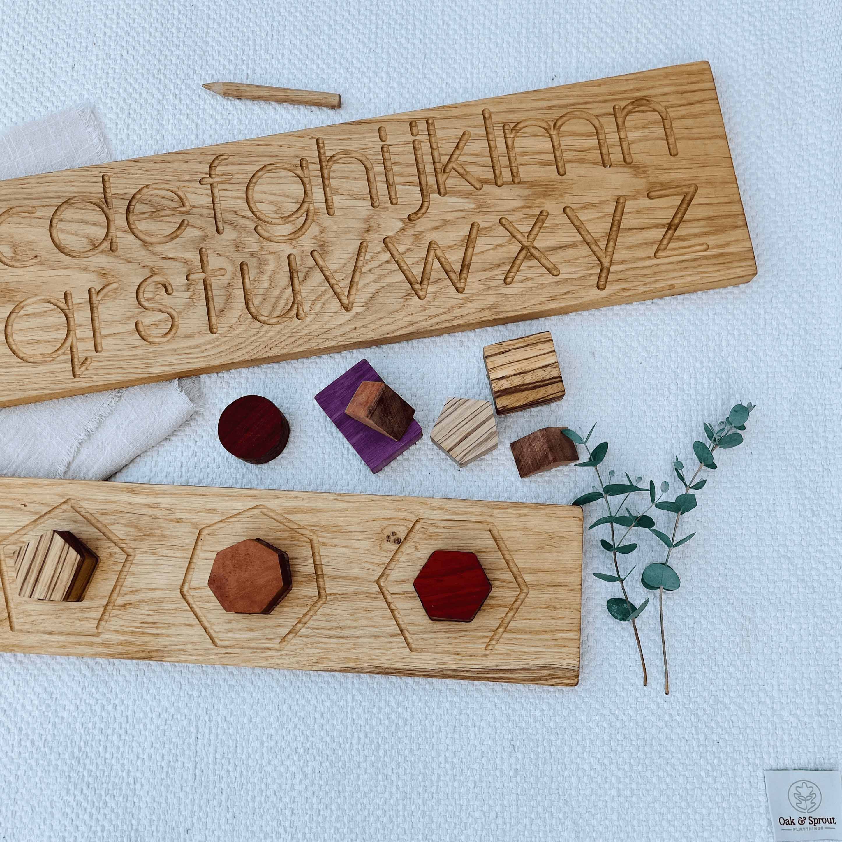 Wooden educational tools with engraved letters and shapes on a light blue background