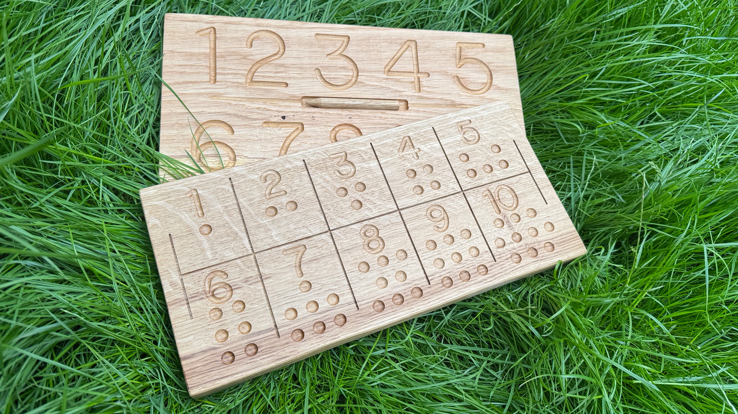 Oak numbers tracing boards on grass
