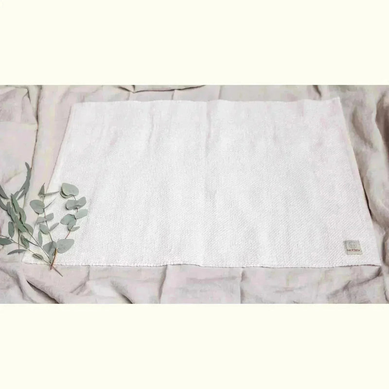Oak & Sprout vehicles collection — white textured play mat with eucalyptus sprig and branded label on linen